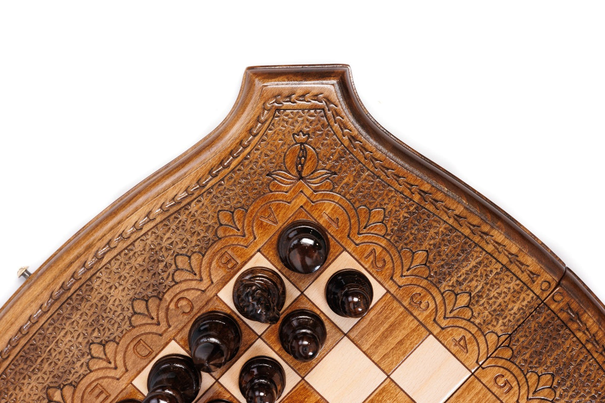 Curved corner of the contour outline board with carved ornament and dark chess pieces