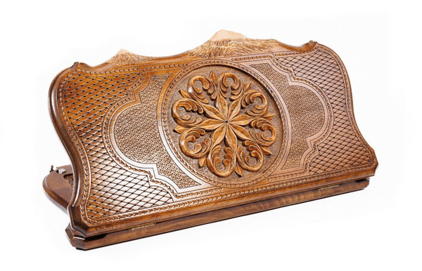 A bird's-eye view of the closed wooden backgammon board highlighting the symmetry of the ornamental patterns and the Mount Ararat outline.