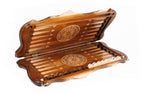 The interior of the open Armenian backgammon board showing the contrasting wood pips and smooth playing lanes.