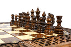 Dark hand-carved chess pieces on the resin-sealed walnut and light wood squares