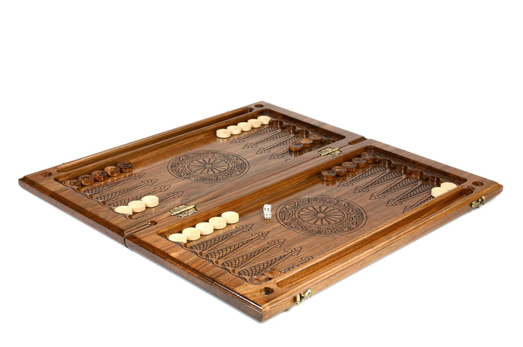Walnut chess and backgammon set opened to the epoxy-finished backgammon field with wheel ornaments