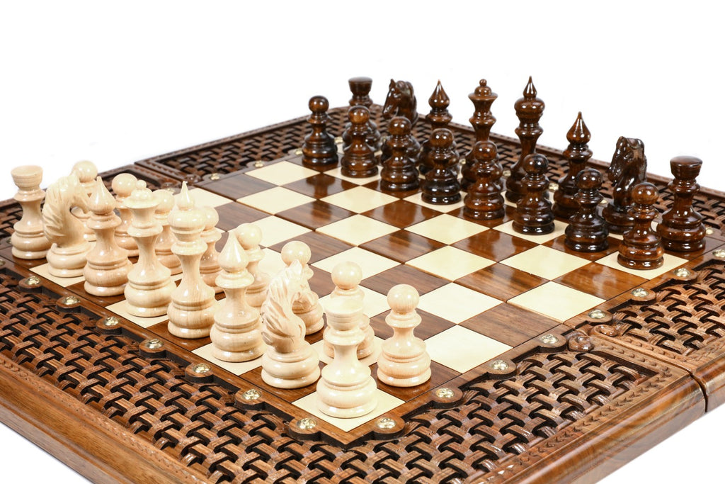 Hand-carved walnut chess board with deep braid border and resin-sealed squares, carved pieces in position