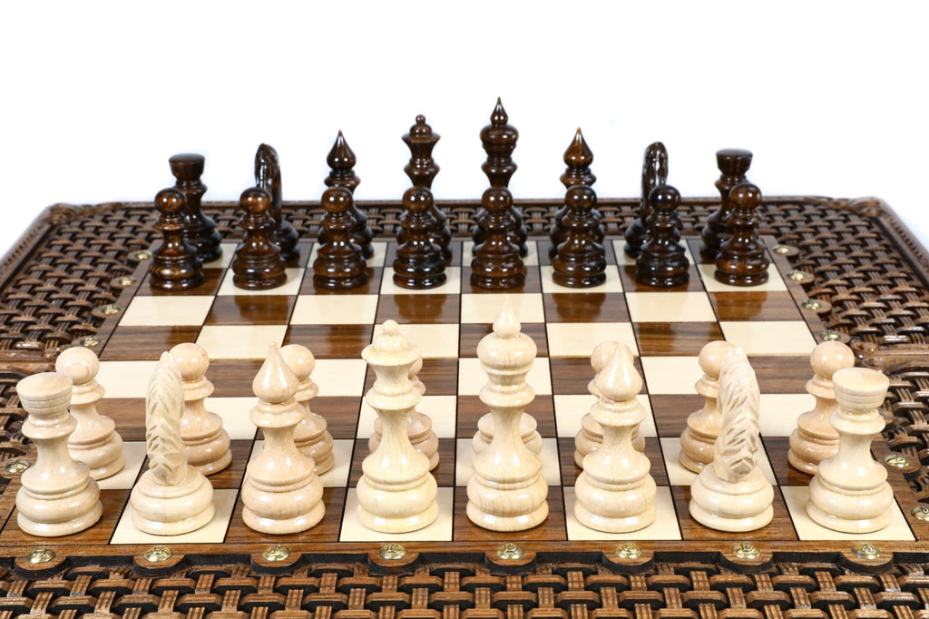 Front view of the luxury walnut chess set with all 32 hand-carved pieces on the glossy epoxy field