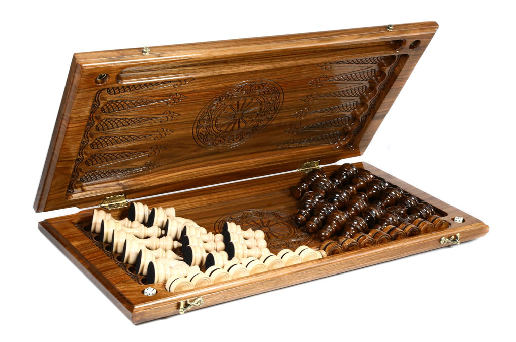Walnut chess backgammon set half open with the hand-carved pieces stored on the backgammon field