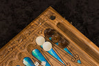 Backgammon side of carved walnut board with blue epoxy resin points, wooden checkers and dice