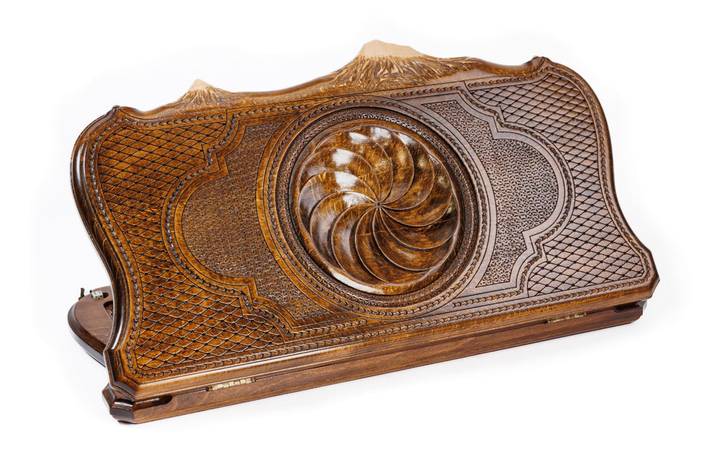 Top-down angle of the crafted wooden backgammon case highlighting the iconic Mount Ararat contour paired with the Eternity symbol.