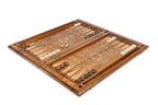 Close-up of the carved horse motif and precise wood finish on the backgammon set exterior.