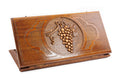 A frontal shot of the closed Grape Cluster classic backgammon board showing the detailed vine and fruit relief carving.