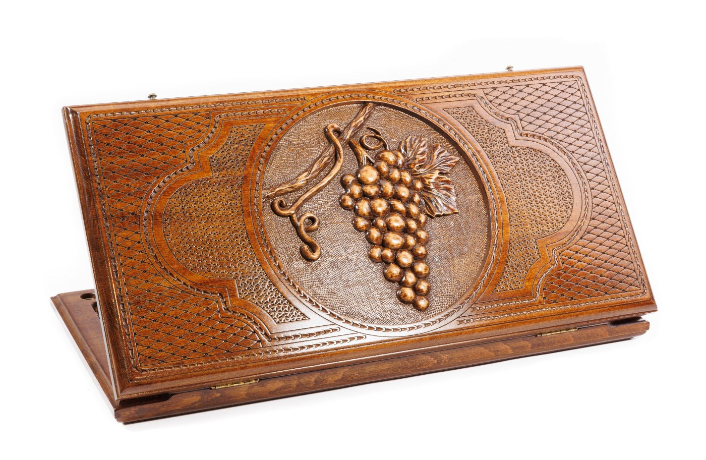 A frontal shot of the closed Grape Cluster classic backgammon board showing the detailed vine and fruit relief carving.