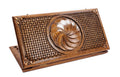 A top-down view of the closed wooden backgammon board featuring the carved Eternity wheel and intricate braid borders.