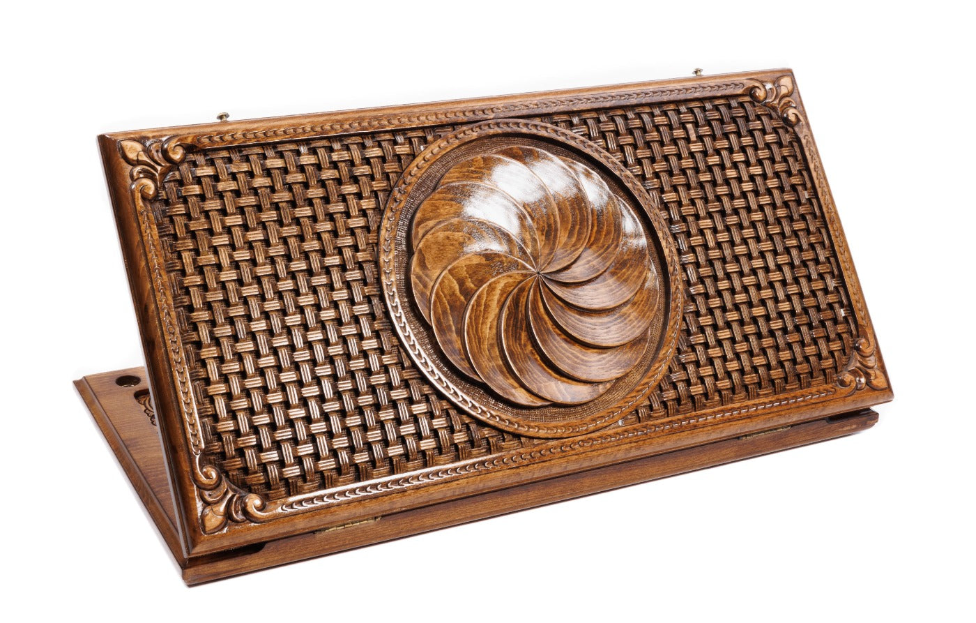 A top-down view of the closed wooden backgammon board featuring the carved Eternity wheel and intricate braid borders.
