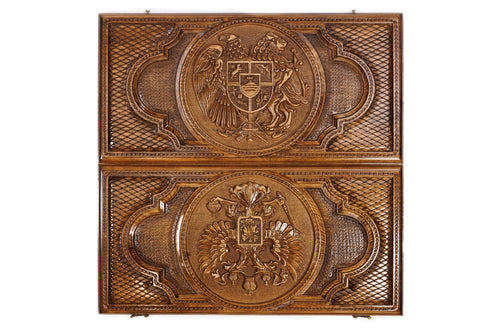 Both covers of the closed two-sided backgammon set from above: Armenia's coat of arms on the lid, Russia's on the back