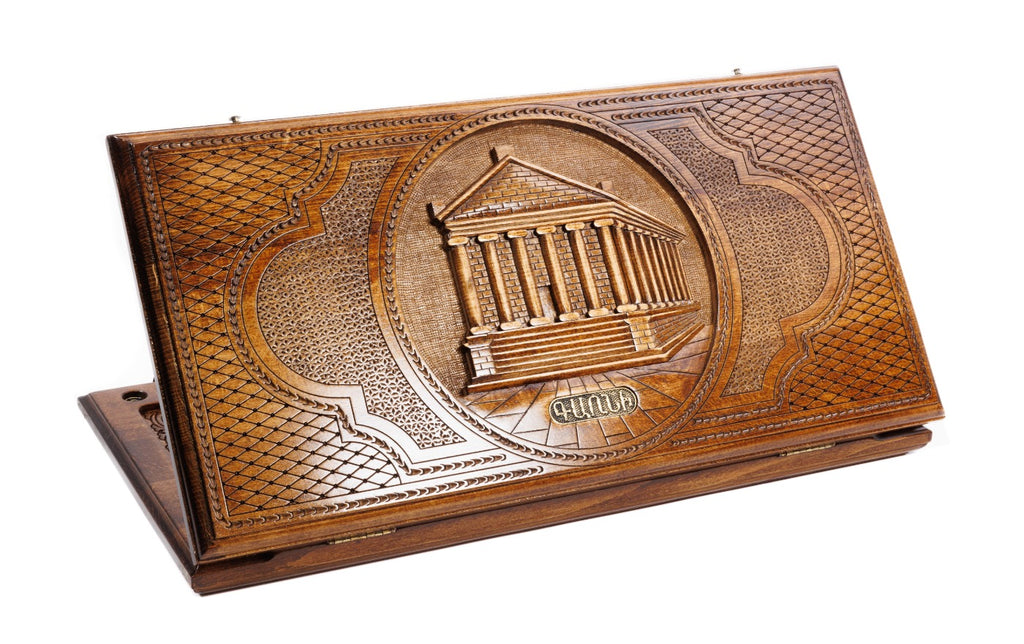 A frontal shot of the closed wooden backgammon case displaying the detailed colonnaded carving of the Garni Temple.