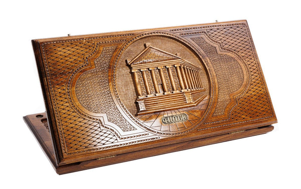 A frontal shot of the closed wooden backgammon case displaying the detailed colonnaded carving of the Garni Temple.
