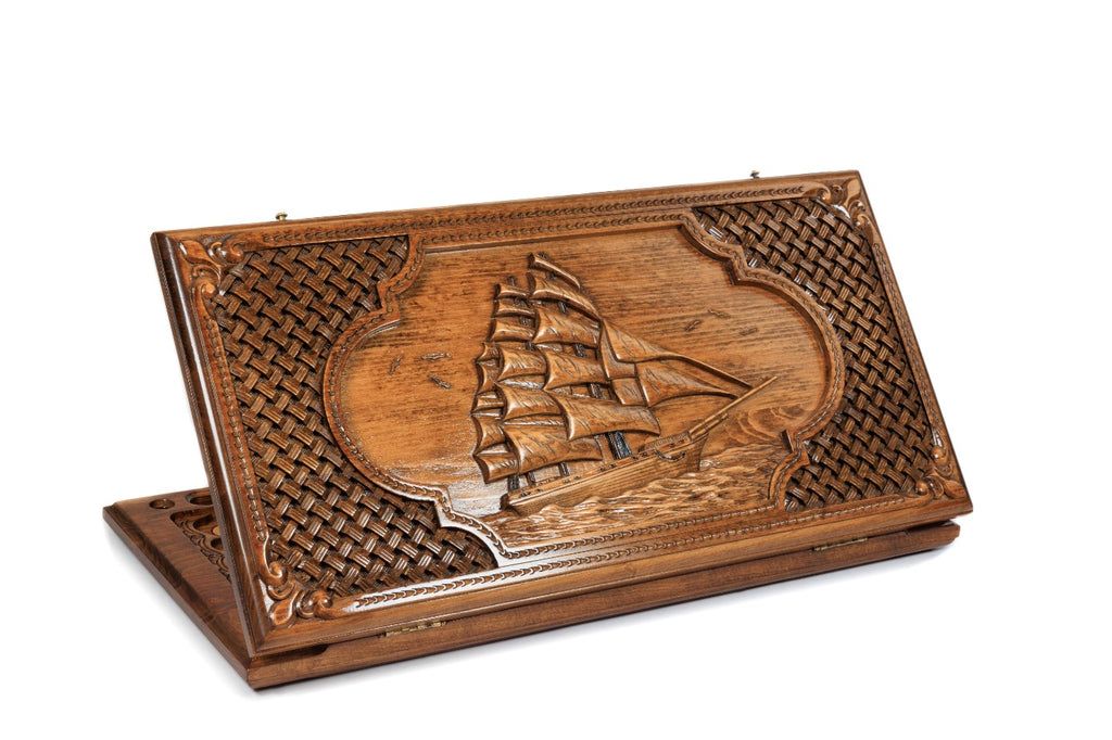 Exterior view of the wooden backgammon board showcasing the sail design and braid motives.