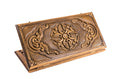 Exterior view of the classic wooden backgammon board showcasing the intricate ornamental design.