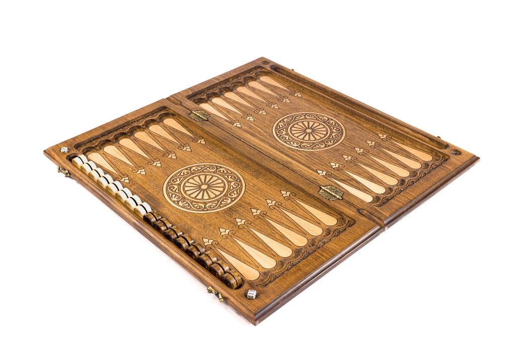 Close-up of the detailed ornamental patterns on the exterior of the backgammon set.