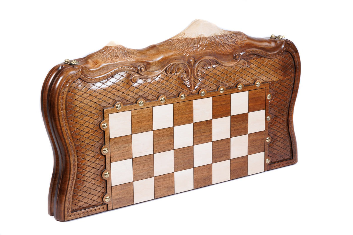 Closed walnut chess board standing on edge, Ararat outline with hornbeam inlay and carved braid frame