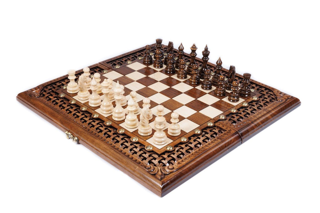 Wooden chess set in solid walnut with open lattice braid border and floral bas-relief corner carvings — by Hrachya Ohanyan