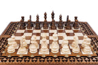 Carved chess and backgammon set - close-up of hand-carved chess pieces