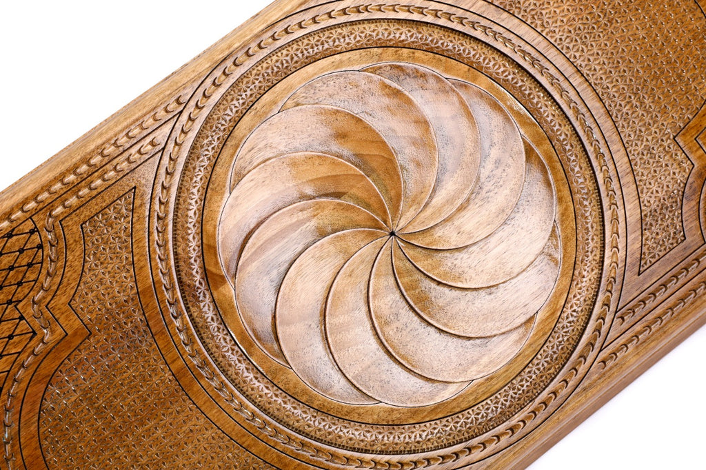 The interior of the open wooden backgammon board highlighting the smooth, polished playing field and natural wood grain.