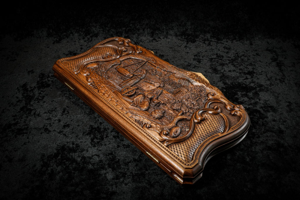 Village scene backgammon set closed, angled view of the deep-relief lid and scroll frame