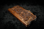 Village scene backgammon set closed, angled view of the deep-relief lid and scroll frame
