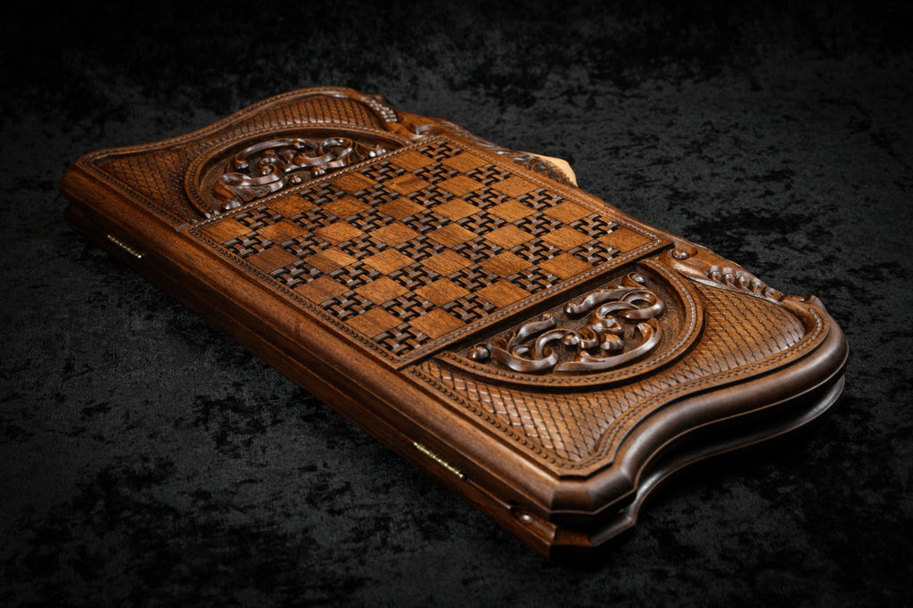 Back cover from above: carved basket-weave chequerboard and scroll ornament cartouches