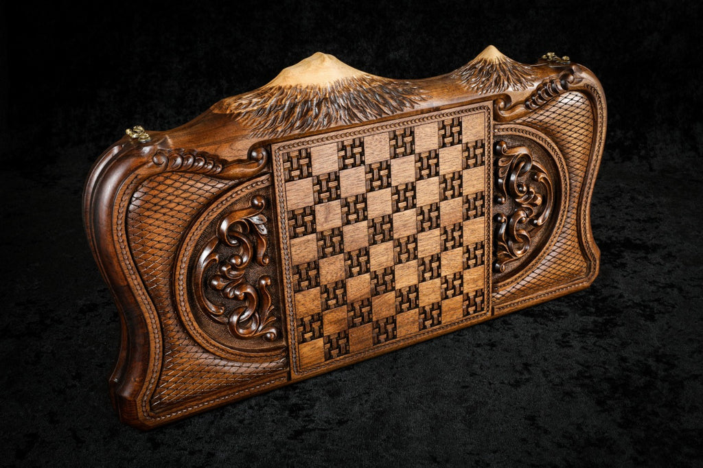 Back cover of the village scene backgammon set: basket-weave chequerboard between carved scroll ornaments