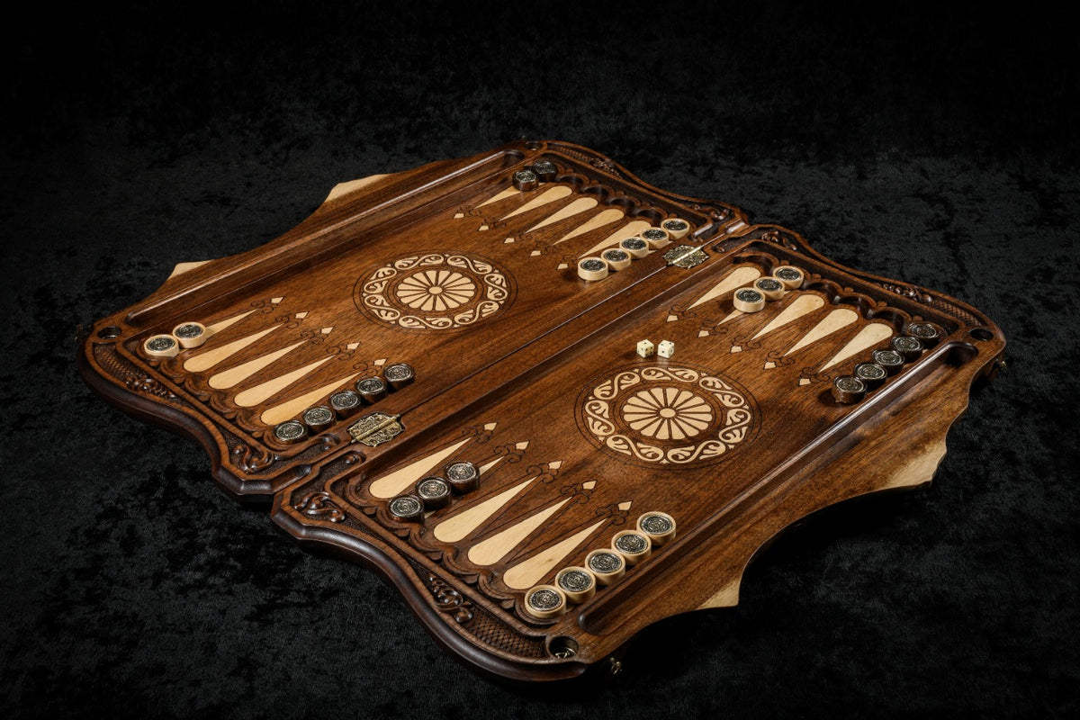 Walnut backgammon set open with hornbeam-inlaid points and the ornament checkers on the 60 cm board, angled view