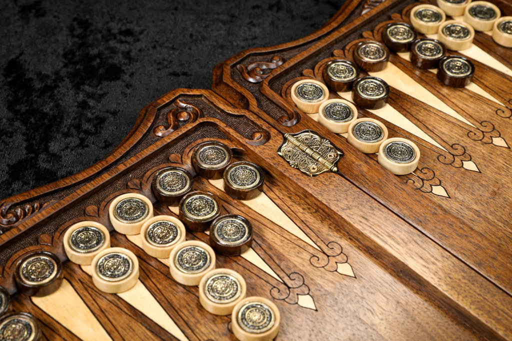 Ornament checkers with bronze and silver emblems on the points, stamped hinge on the bar