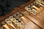 Ornament checkers with bronze and silver emblems on the points, stamped hinge on the bar