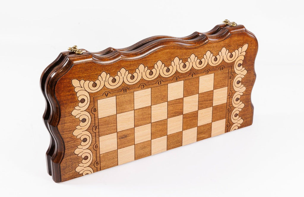 Wooden chessboard with decorative border on a white background
