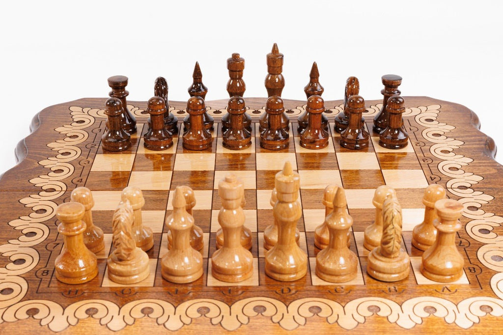 Wooden chess set with pieces on a checkered board