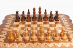 Wooden chess set with pieces on a checkered board