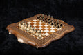 Luxury walnut chess and backgammon set with bronze pieces set up on the hornbeam chessboard in its basket-weave frame, 60 cm