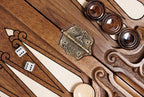 Stamped cast-bronze hinge on the bar of the open backgammon board with checkers and dice