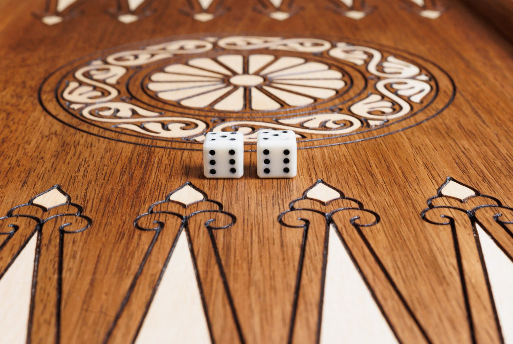 Wheel ornament with two dice on the open backgammon board, hornbeam points below