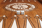 Wheel ornament with two dice on the open backgammon board, hornbeam points below