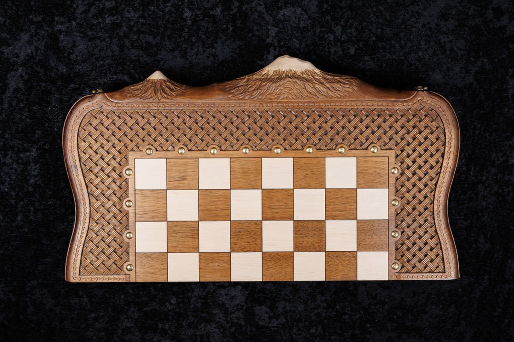 Chess and backgammon set closed, seen from above with the chessboard and basket-weave frame