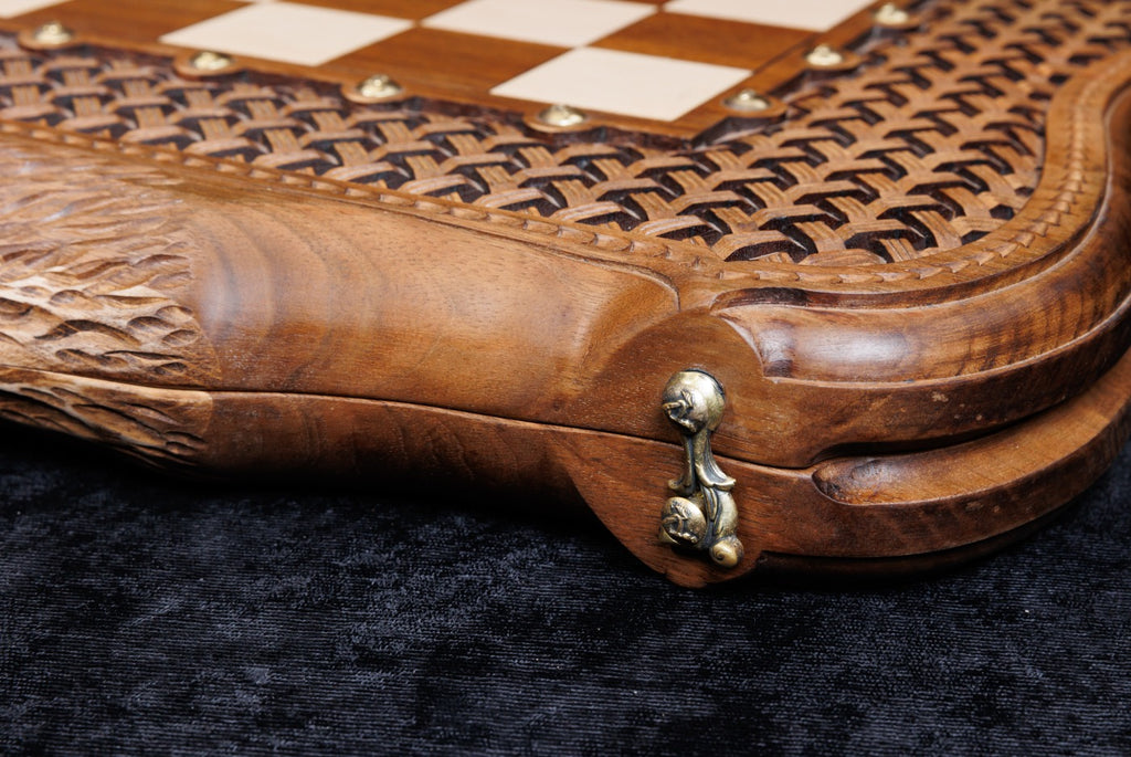 Close-up of the basket-weave braid carved in relief with bronze studs and the cast-bronze clasp