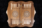 Backgammon board open from above: hornbeam-inlaid points and wheel ornaments on the walnut field