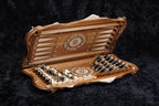 Set half open showing the backgammon field, the bronze chess pieces and checkers inside