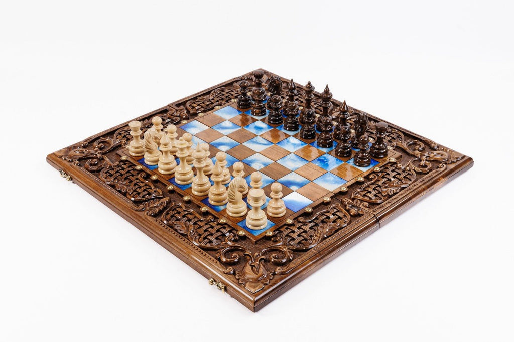 Luxury wooden chess set in solid walnut with blue epoxy resin squares and ornamental braid border — by Hrachya Ohanyan