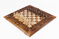 Luxury wooden chess set in solid walnut with open lattice braid border and hand-sculpted floral carvings — by Hrachya Ohanyan