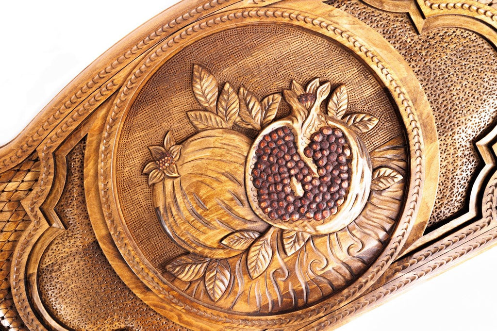 Luxury backgammon board with pomegranate artistic wooden detail outline

