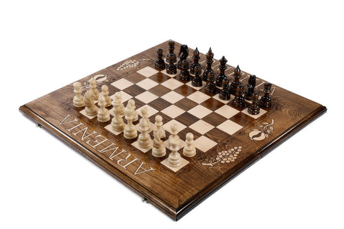 Armenian wooden chess set with engraved pomegranate and grape vine motifs in dark beech wood — by Hrachya Ohanyan