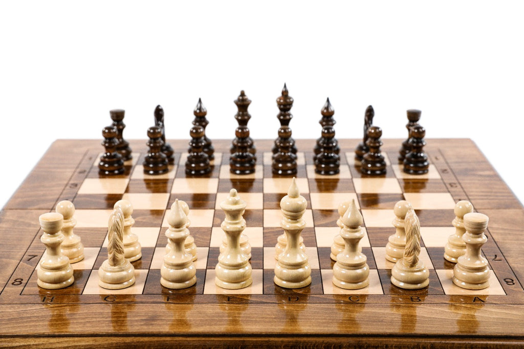 Front view of the classic chess set with all 32 hand-carved pieces and carved coordinates on the border