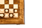 Corner detail of the smooth wooden frame with carved letters and numbers and light pieces