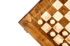 Close view of light chess pieces on the plain classic chess board